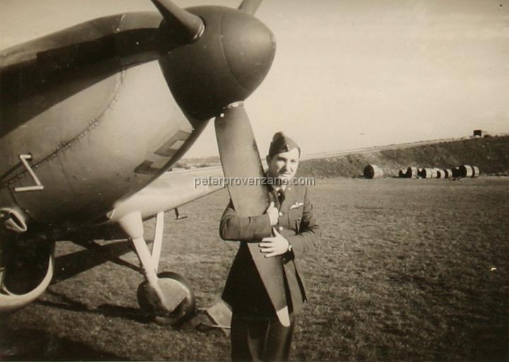 Peter Provenzano Photo Album Image_copy_014.jpg - Paul Anderson holding on to the propeller of a Miles Master Mark IA trainer.  RAF Station Sealand, October 1940.